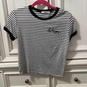 Short sleeve black and white striped shirt with “be happy” on the heart